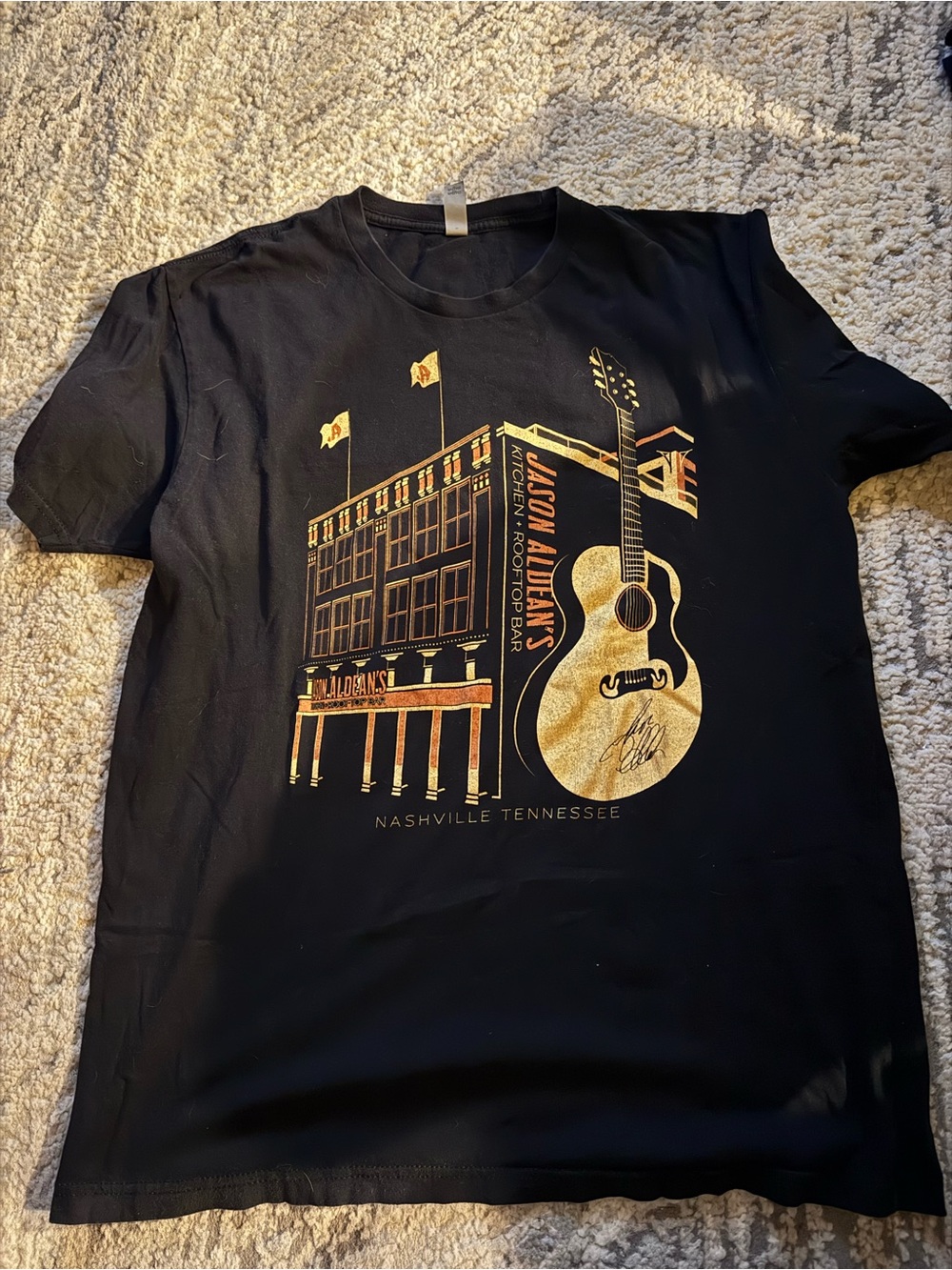 Jason Aldeans rooftop bar Black Tee with Gold Nashville Guitar Graphic